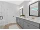 Elegant bathroom featuring double vanity with sleek countertop and modern lighting at 18 Torry Pines Cir, Villa Rica, GA 30180