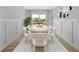 Bright dining room featuring a white table with seating for six and a large window at 18 Torry Pines Cir, Villa Rica, GA 30180