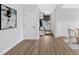 Inviting foyer with wood flooring, a storage bench, and an elegant art piece at 18 Torry Pines Cir, Villa Rica, GA 30180