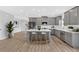 Spacious kitchen boasts a center island, stainless steel appliances, and sleek gray cabinetry at 18 Torry Pines Cir, Villa Rica, GA 30180