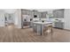 Modern kitchen with gray cabinetry, stainless steel appliances, and a stylish center island at 18 Torry Pines Cir, Villa Rica, GA 30180