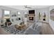 Bright living room with stone fireplace, hardwood floors, and large windows with a view at 18 Torry Pines Cir, Villa Rica, GA 30180