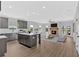 Open-concept living space with a fireplace, kitchen island, and lots of natural light at 18 Torry Pines Cir, Villa Rica, GA 30180