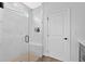 Beautiful marble-tiled shower with glass enclosure and built-in niche at 18 Torry Pines Cir, Villa Rica, GA 30180