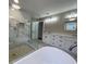 Newly remodeled bathroom with a glass walk-in shower, soaking tub, and double vanity at 3189 A Jackson, Hapeville, GA 30354