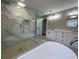 Newly remodeled bathroom with a glass walk-in shower, soaking tub, and double vanity at 3189 A Jackson, Hapeville, GA 30354