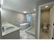 Bathroom features walk-in shower, freestanding tub, double vanity, and private toilet room at 3189 A Jackson, Hapeville, GA 30354