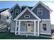 Charming two-story home with light blue exterior, covered front porch, and well-maintained lawn at 3189 A Jackson, Hapeville, GA 30354
