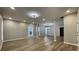 Expansive living room featuring contemporary flooring, neutral paint, recessed lights and an open concept design at 3189 A Jackson, Hapeville, GA 30354