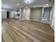 Spacious living room with modern floors leading into kitchen and staircase at 3189 A Jackson, Hapeville, GA 30354