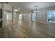 Spacious living room with hardwood floors, natural light, and modern lighting fixture at 3189 A Jackson, Hapeville, GA 30354