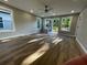 Light-filled room features beautiful wood floors, recessed lights, and access to a small deck at 3189 A Jackson, Hapeville, GA 30354