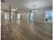 Spacious living room with hardwood floors, natural light, and modern lighting fixture at 3189 A Jackson, Hapeville, GA 30354
