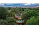Aerial view of the property showcasing the house, pool, and surrounding lush greenery at 4820 Coppedge Trl, Duluth, GA 30096