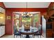 Cozy dining space with a bay window, a view, and a unique chandelier at 4820 Coppedge Trl, Duluth, GA 30096