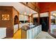 Spacious kitchen with brick accents, an island, stainless steel appliances, and granite counters at 4820 Coppedge Trl, Duluth, GA 30096