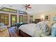 Bright main bedroom with vaulted ceilings, French doors to deck, and large windows with wooden shutters at 4820 Coppedge Trl, Duluth, GA 30096