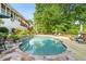 Inviting pool area with a pool deck, seating, and lush landscaping for relaxation and enjoyment at 4820 Coppedge Trl, Duluth, GA 30096