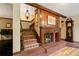 Unique staircase with a carpet runner, fireplace, and vintage furniture at 4820 Coppedge Trl, Duluth, GA 30096