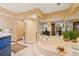 Bathroom features a large soaking tub with a separate shower and vanity at 4820 Coppedge Trl, Peachtree Corners, GA 30096