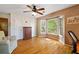 Bedroom with bay window offering natural light, wood floors and a ceiling fan at 4820 Coppedge Trl, Peachtree Corners, GA 30096