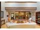 Warm living room featuring a brick fireplace and an open floor plan at 4820 Coppedge Trl, Peachtree Corners, GA 30096