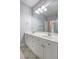The bathroom includes a double vanity, tile flooring and modern lighting at 1203 Stratford Commons Commons, Decatur, GA 30030