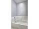 This bathroom features a tile wall surrounding a modern bath tub at 1203 Stratford Commons Commons, Decatur, GA 30030