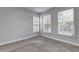Neutral bedroom with a ceiling fan and several large windows at 1203 Stratford Commons Commons, Decatur, GA 30030