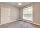 Neutral bedroom with carpet, large window, and ceiling fan at 1203 Stratford Commons Commons, Decatur, GA 30030