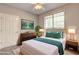 Staged bedroom with a queen-sized bed and a window offering natural light at 1203 Stratford Commons Commons, Decatur, GA 30030