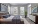Serene bedroom boasts large windows, gray walls, and a patio door at 1203 Stratford Commons Commons, Decatur, GA 30030