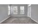 Neutral bedroom featuring large windows, gray walls, and a patio door at 1203 Stratford Commons Commons, Decatur, GA 30030