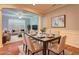 Open-concept dining area with a dining table set for a meal next to the living room at 1203 Stratford Commons Commons, Decatur, GA 30030