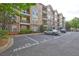 Condo building featuring balconies and reserved parking, view of side of building at 1203 Stratford Commons Commons, Decatur, GA 30030