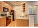 Galley-style kitchen featuring a black refrigerator and stainless steel appliances at 1203 Stratford Commons Commons, Decatur, GA 30030