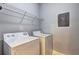 Laundry room with a washer, dryer and wire shelf at 1203 Stratford Commons Commons, Decatur, GA 30030