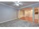Bright living room with gray carpet and open view to the kitchen at 1203 Stratford Commons Commons, Decatur, GA 30030