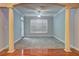 Empty living room featuring gray carpet, large window and classic architectural details at 1203 Stratford Commons Commons, Decatur, GA 30030