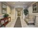 Condo lobby with tile floors, seating, table with flowers and entry to elevator at 1203 Stratford Commons Commons, Decatur, GA 30030