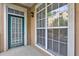 The patio features a green entry door and large grid-paned windows at 1203 Stratford Commons Commons, Decatur, GA 30030