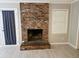 Cozy living area with brick fireplace, neutral walls, and natural light creates a welcoming atmosphere at 2553 Country Club Dr, Conyers, GA 30013