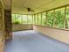 Spacious screened porch with exposed brick and views of the backyard at 2553 Country Club Dr, Conyers, GA 30013