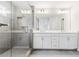 Bathroom featuring glass enclosed shower, tile floor, and double vanity sinks at 2560 Clairebrooke Bnd, Atlanta, GA 30341