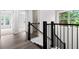 Hallway with a staircase, wood floors, and natural light at 2560 Clairebrooke Bnd, Atlanta, GA 30341