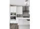Bright kitchen features white cabinetry, stainless steel appliances, and marble countertops at 2560 Clairebrooke Bnd, Atlanta, GA 30341