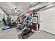 Basement gym area with exercise equipment and ceiling fan at 2921 Terra View Sw Dr, Lilburn, GA 30047