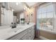 Well-lit bathroom with a double vanity, soft natural light, and modern decor at 2921 Terra View Sw Dr, Lilburn, GA 30047