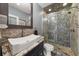 Bathroom with a modern vessel sink and tiled glass door shower at 2921 Terra View Sw Dr, Lilburn, GA 30047