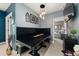 Dining area with black table, decorative walls, and access to the bedroom at 2921 Terra View Sw Dr, Lilburn, GA 30047